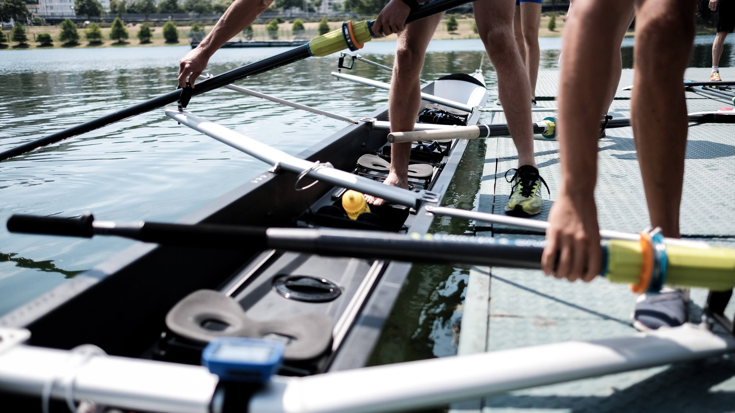 A crew rigging up and boarding at the dock